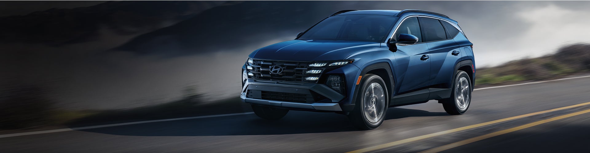 Blue Hyundai SUV driving on the road